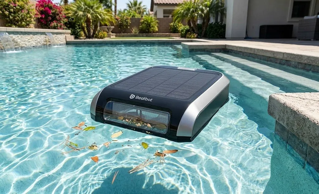 Beatbot iSkim removing floating debris from a swimming pool.